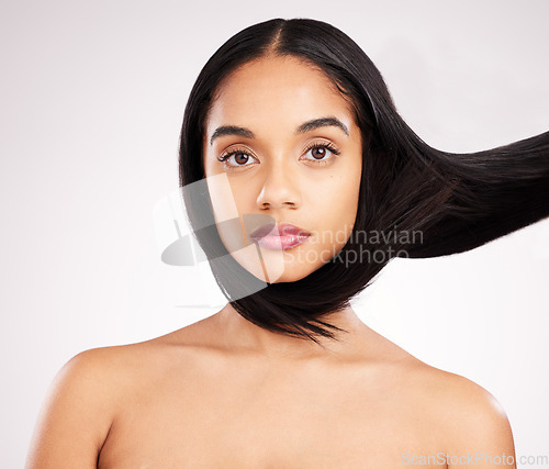 Image of Beauty, hairstyle and portrait of woman in studio for shampoo, confidence and keratin treatment. Textures, salon and shine with serious female model on white background for self care and cosmetics