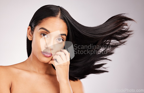 Image of Hair flip, portrait and beauty of a woman in a isolated, white background and studio with salon treatment. Cosmetics, self care glow and young female model with healthy hairstyle texture and haircut