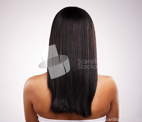 Image of Hair, back and beauty of a woman in a isolated, white background and studio with salon treatment. Cosmetics, self care and young female model with healthy hairstyle texture and haircut growth