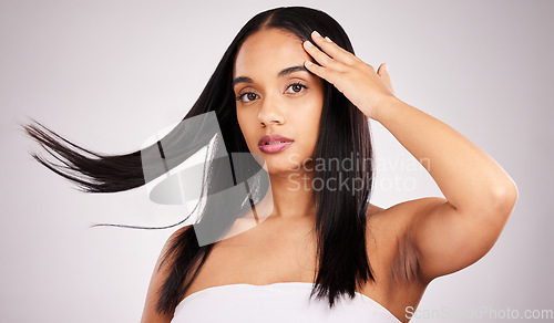 Image of Beauty, hair and portrait of woman in studio for keratin treatment, shampoo and self care. Salon, texture and natural with model isolated on white background for shine, satisfaction and results