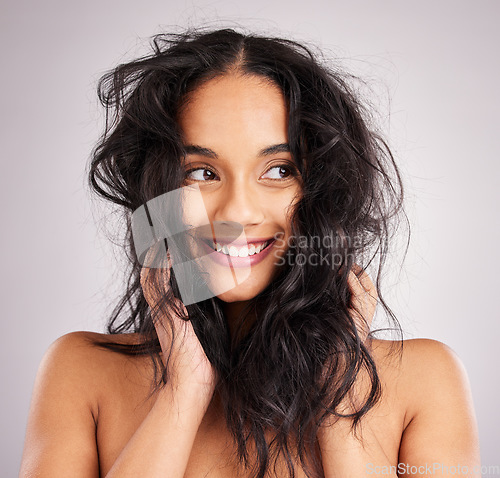 Image of Hair, happy with woman and beauty, messy hairstyle and cosmetics on studio background. Wellness, shine and female smile, face and cosmetic care, keratin treatment and texture with volume and growth