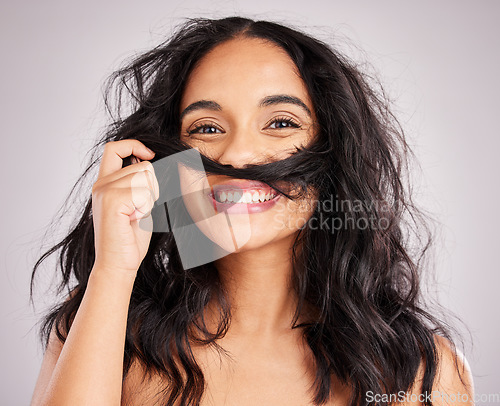 Image of Hair, happy woman and beauty with portrait, playful with cosmetics and messy hairstyle on studio background. Wellness, shine and female smile, face and treatment, keratin and texture with volume