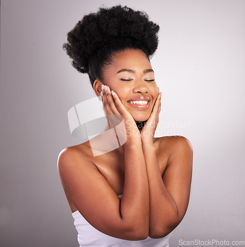 Image of Skincare, African beauty and black woman with hands on face, confidence in white background and cosmetics product. Health, dermatology and natural makeup, model in studio for healthy skin and care.