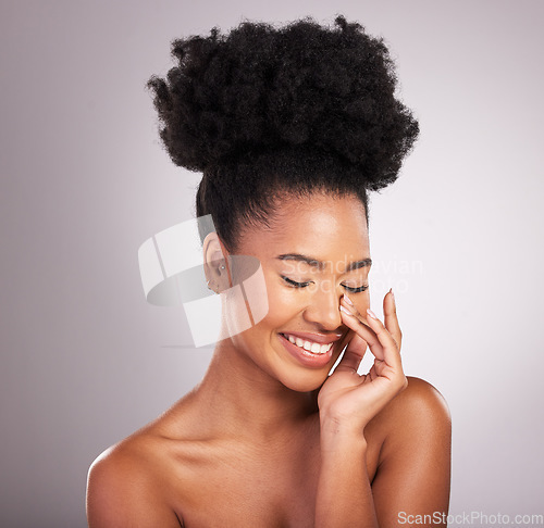 Image of Skincare, beauty and smile, black woman with happiness, white background and cosmetics. Health, dermatology and natural makeup and African model in studio for healthy skin care and wellness