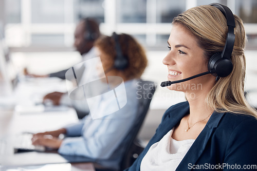 Image of Woman, call center and smile with headset for telemarketing, customer service or support at office desk. Happy and friendly female consultant agent smiling with headphones for online advice or help