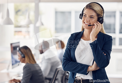 Image of Woman, call center and smile in leadership with headset for telemarketing, customer service or support at office. Happy female consultant manager smiling with headphones for online advice or coaching