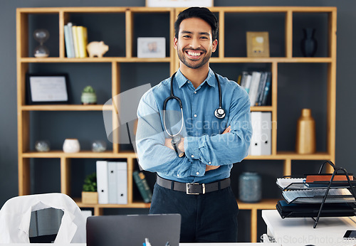 Image of Portrait, healthcare and man with arms crossed, hospital and happiness with development, medicine and research. Face, medical professional and happy male employee with confidence, wellness or success
