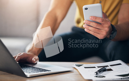 Image of Hands, laptop and phone with man in the living room, sitting on a sofa in his home for future growth planning. Computer, research and smartphone with a male browsing the internet for information