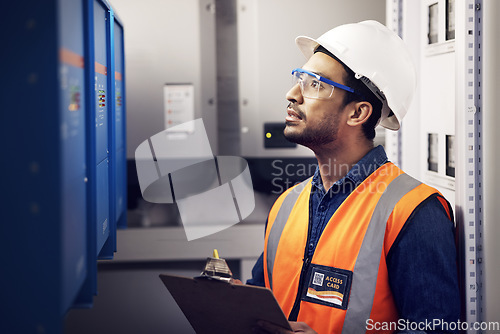 Image of Man, engineering and technician in control room, box inspection and machine maintenance on clipboard. Male electrician, system and electrical substation for power, industrial generator and checklist