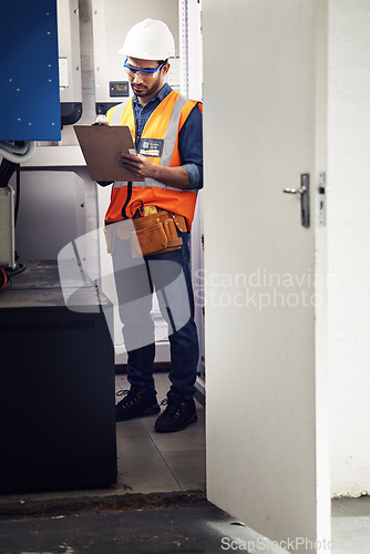 Image of Man, technician and engineering with clipboard in control room, writing notes and machine maintenance. Male electrician, system and electrical substation for power, mechanic inspection and checklist