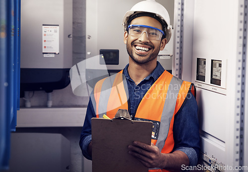 Image of Portrait of happy man, engineering and technician at control panel, inspection and maintenance planning on clipboard. Male electrician smile at electrical substation for power, system and checklist