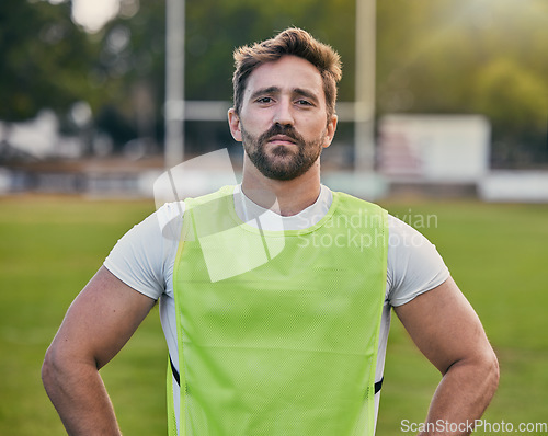 Image of Rugby, game and portrait of man with confidence, serious expression and pride in winning game on field. Fitness, sports and face of player ready for match, workout or competition on grass at stadium.