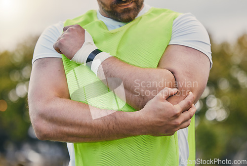 Image of Rugby, pain and man with elbow injury on sports field after practice match, training and game outdoors. Medical emergency, accident and male athlete with joint inflammation, arm sprain and tendinitis