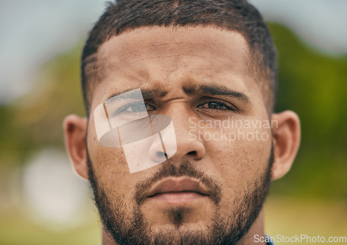 Image of Rugby, focus and portrait of man with serious expression, confidence and pride in winning game. Fitness, sports and zoom on face of player ready for match, workout or competition on grass at stadium.