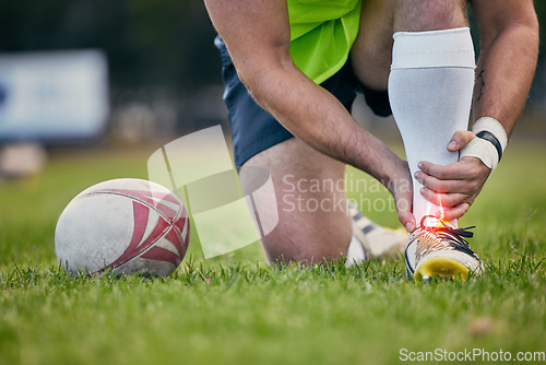 Image of Rugby, pain and man with foot injury on sports field for practice match, training and game on grass. Medical emergency, accident and male athlete with joint inflammation, ankle sprain and tendinitis