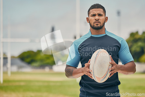 Image of Rugby, field and portrait of man with ball, serious expression and confidence in winning game. Fitness, sports and player training for match, workout or competition on grass at stadium with mockup.