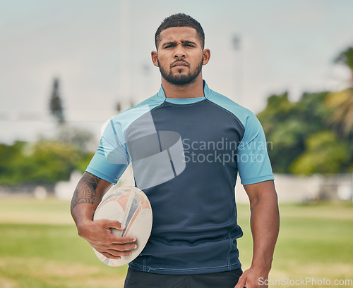 Image of Rugby, ball and portrait of tough man on field with serious expression, confidence and pride in winning game. Fitness, sports and player ready for match, workout or competition on grass at stadium.