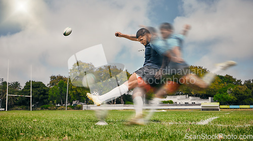 Image of Rugby, blur and man kicking ball to score goal on field at game, match or practice workout. Sports, fitness and motion, player running to kick at poles on grass with energy and skill in team sport.