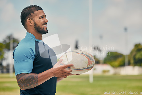 Image of Rugby, field and happy man with ball, confidence and pride in winning competition game. Fitness, sports and happiness, professional player with smile, ready for match and workout on grass at stadium.