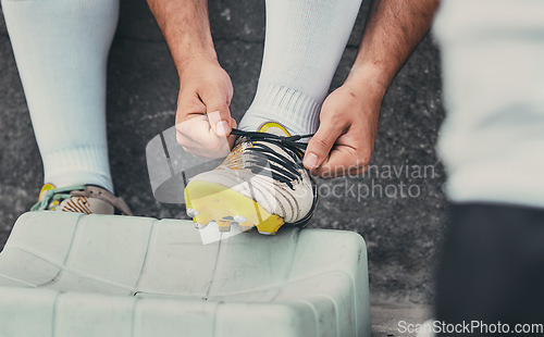 Image of Rugby, tie shoes or sports man ready to start playing a training game for cardio exercise or workout. Zoom, fitness or hands of athlete player with footwear or boots in outdoor stadium in France