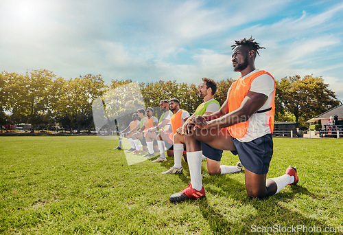 Image of Sports, training and team outdoor for rugby on a grass field with men doing knee exercise. Athlete group together for fitness and workout for professional sport with diversity, support and teamwork