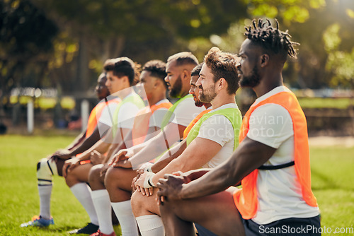 Image of Rugby sport, diversity and men training outdoor on a grass field with a team on knee. Athlete group together for fitness, exercise and workout for professional sports club and strong teamwork