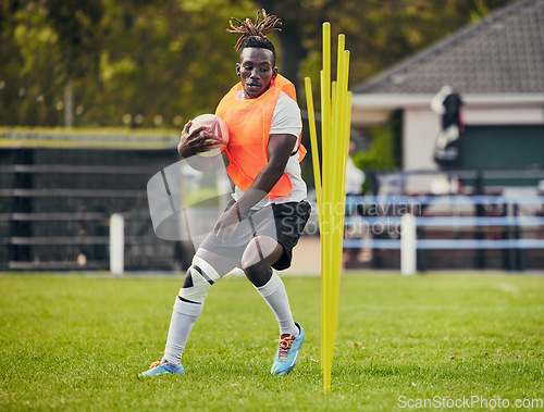 Image of Rugby, sports and black man training with equipment ready for match, practice and sport games. Fitness, performance and serious male athlete running for warm up, exercise and workout for competition