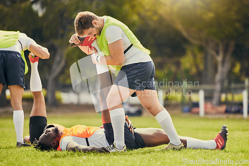 Image of Rugby sports, men training and stretching outdoor on grass field with team warm up for legs. Athlete group together for fitness, exercise and workout for professional sport with coach and teamwork