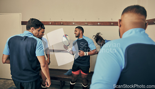 Image of Locker room, motivation and team building, rugby players in strategy discussion or game plan with ball. Training, coaching and group of sports men planning teamwork with leader in cloakroom together.