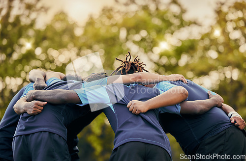 Image of Team, men and huddle in sports for support, motivation or goals for coordination outdoors. Sport group and rugby scrum together for fitness, teamwork or success in collaboration before match or game