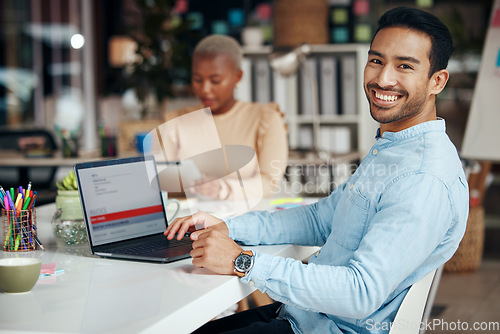 Image of Portrait, smile and business man in office with pride for career, occupation or job. Ceo, boss and happy, proud or confident Asian professional entrepreneur sitting at table with laptop in company.