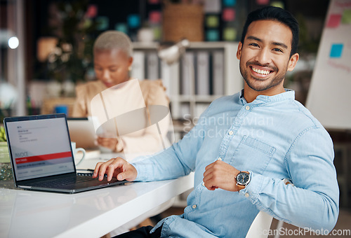 Image of Portrait, smile and business man in office with pride for career, occupation or job. Ceo, night and happy, proud or confident Asian professional accountant sitting at table with laptop in company.