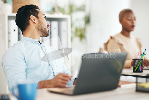 Image of Office, talking and business man at desk on break in conversation, speaking and chatting to coworker. Creative startup, company and male worker with computer working on project, report and research