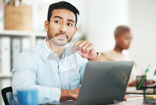 Image of Man at desk, thinking with laptop and relax with ideas for content creation at digital marketing startup. Copywriter, thoughtful male and serious, contemplating and inspiration for copywriting job