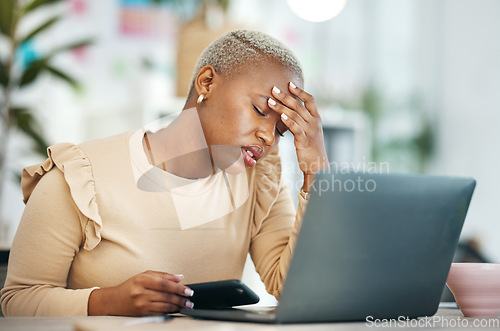 Image of Stress, migraine and African businesswoman in the office while working on project with laptop. Burn out, tired and professional female business employee with a headache in modern corporate workplace.