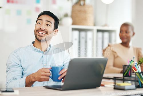 Image of Laptop, coffee and happy with a business man at work in his office, taking a break during a project. Computer, drink and internet search with a male employee working in a creative startup workplace