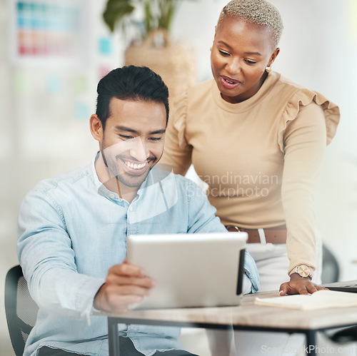 Image of Creative business people, tablet and smile in digital marketing for planning design at the office desk. Happy asian man and black woman smiling with touchscreen for project plan or startup strategy