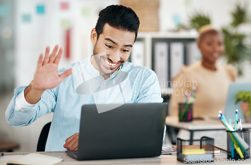 Image of Asian man, laptop and waving on video call for meeting, introduction or webinar at office desk. Happy creative designer with smile in communication, networking or talking on computer for startup