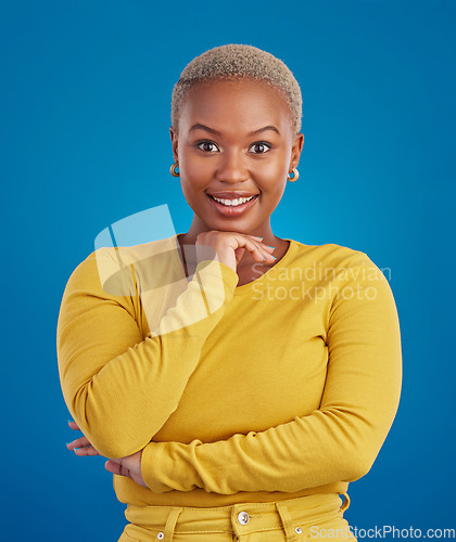 Image of Happy, smile and portrait of black woman with confidence, happiness and empowerment in studio. Yellow fashion, beauty and girl model on blue background with pride, positive mindset and motivation