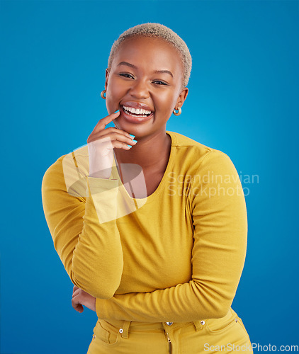 Image of Portrait, happy and black woman in studio smile, cheerful and laughing on mockup, space or blue background. Face, joy and female laugh, joke and silly humor, carefree and having fun while isolated