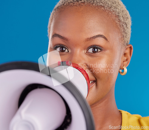 Image of Megaphone, opinion and speaker with black woman in studio for change, democracy and protest. Vote, announcement and message with female isolated on blue background for empowerment, strike and choice