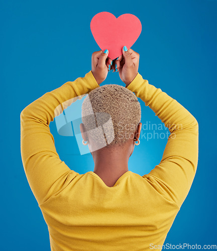 Image of Paper, heart and back of black woman in studio for love, date and kindness. Invitation, romance and feelings with female and shape isolated on blue background for emotion, support and affectionate