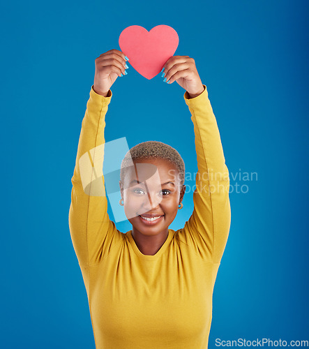Image of Paper, heart and portrait of black woman in studio for love, date and kindness. Invitation, romance and feelings with female and shape isolated on blue background for emotion, support or affectionate