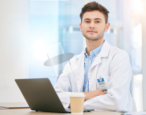 Image of Laptop, doctor and portrait of man in hospital at desk for internet, telehealth app and medical research. Healthcare, insurance and serious health worker in clinic for consulting, medicine and online