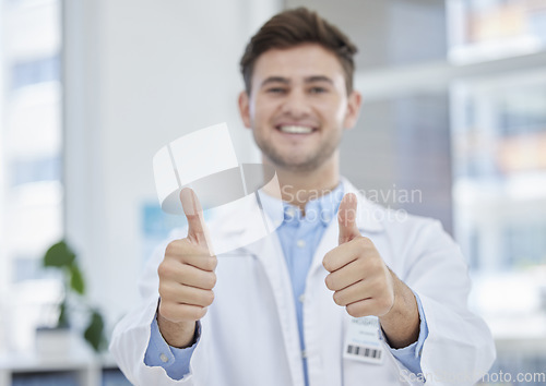 Image of Medical, thumbs up and portrait of happy doctor with hand gesture or sign excited for good news in a clinic. Young, medicine and man healthcare professional in agreement, thank you and satisfied