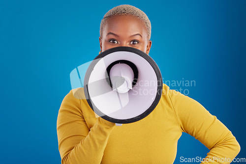 Image of Megaphone, change and speaker with black woman in studio for awareness, democracy and opinion. Vote, announcement and message with female on blue background for empowerment, strike and choice