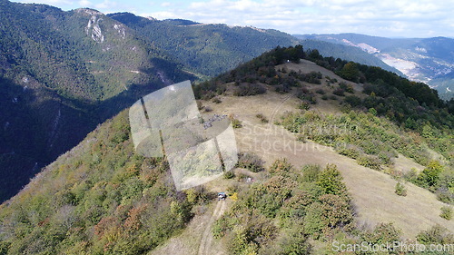 Image of Aerial drone view of ATV quads on a dirt trail in forests. Off-road group team club enthusiasts having fun while driving countryside roads.