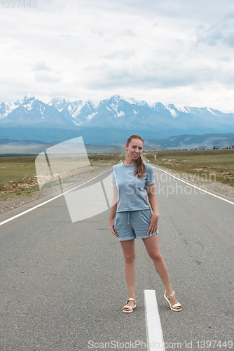 Image of Woman sitting on the road