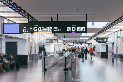 Image of Peoples walking in Vienna airport terminal