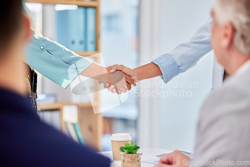 Image of Business people, handshake and partnership for meeting, greeting or introduction at the office. Employees shaking hands in collaboration for teamwork, b2b or support in trust or deal at the workplace